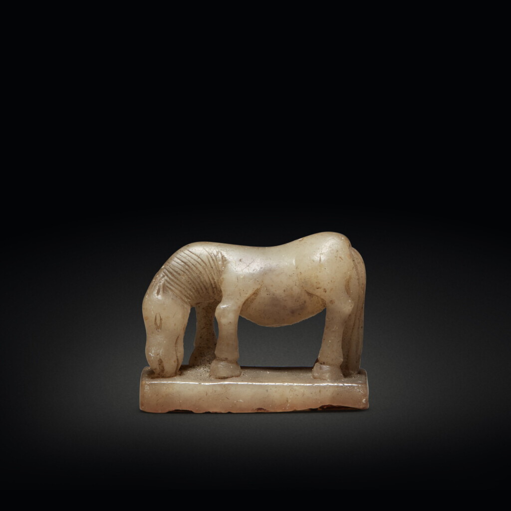 View full screen - View 1 of Lot 589. A miniature beige jade 'horse' seal, Ming / Qing dynasty | 明 / 清 玉袖珍馬鈕印.