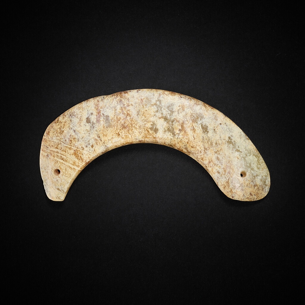 View full screen - View 1 of Lot 3774. A calcified celadon jade 'fish' pendant, Neolithic period, Hongshan culture | 新石器時代 紅山文化 青玉魚形珮.