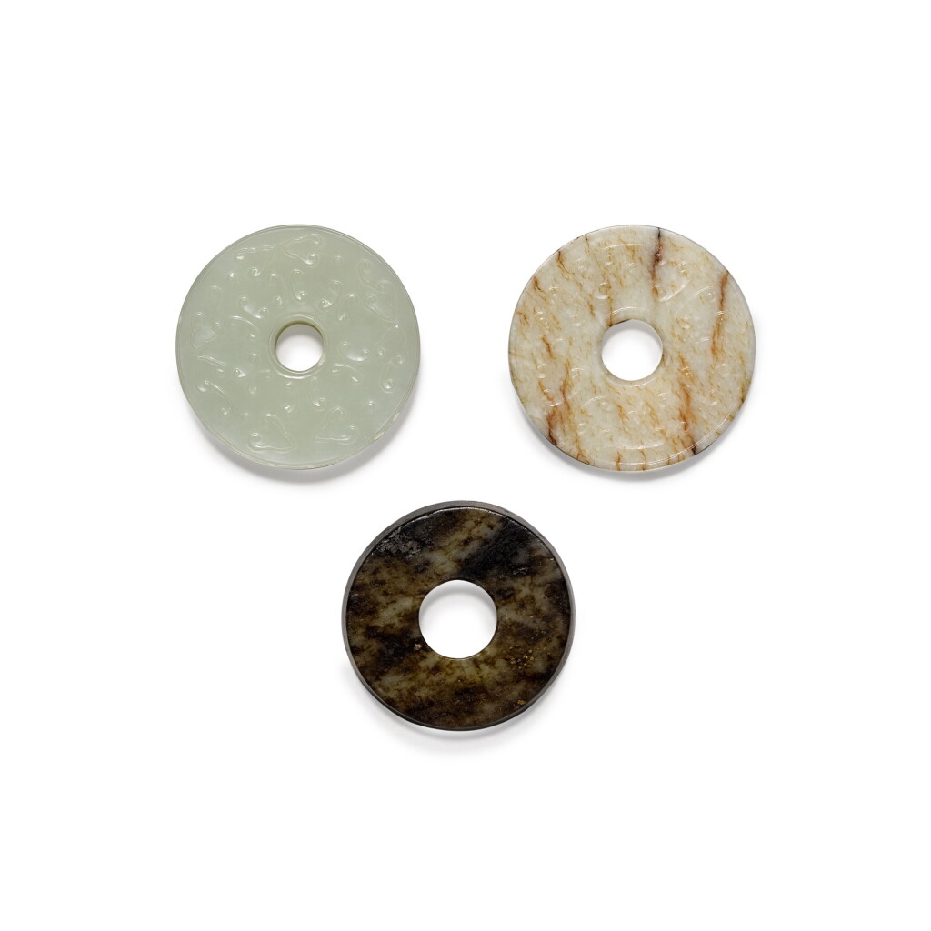 View full screen - View 1 of Lot 20. Three jade discs Qing Dynasty, 19th century | 清十九世紀 玉璧一組三件.