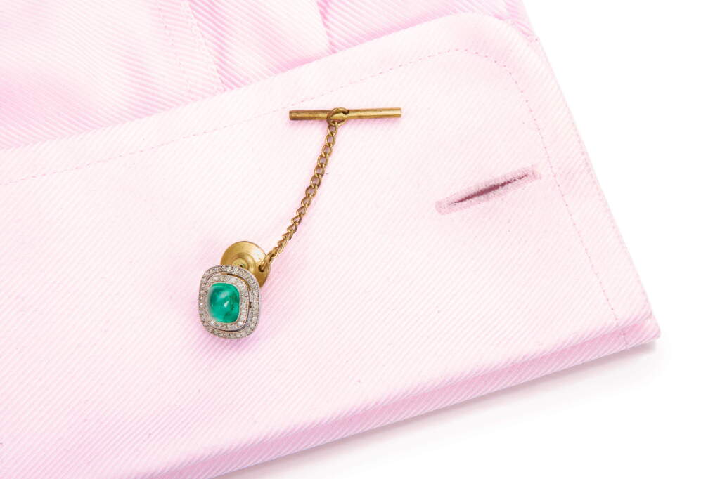 View full screen - View 1 of Lot 1061. EMERALD AND DIAMOND PIN, EARLY 20TH CENTURY.