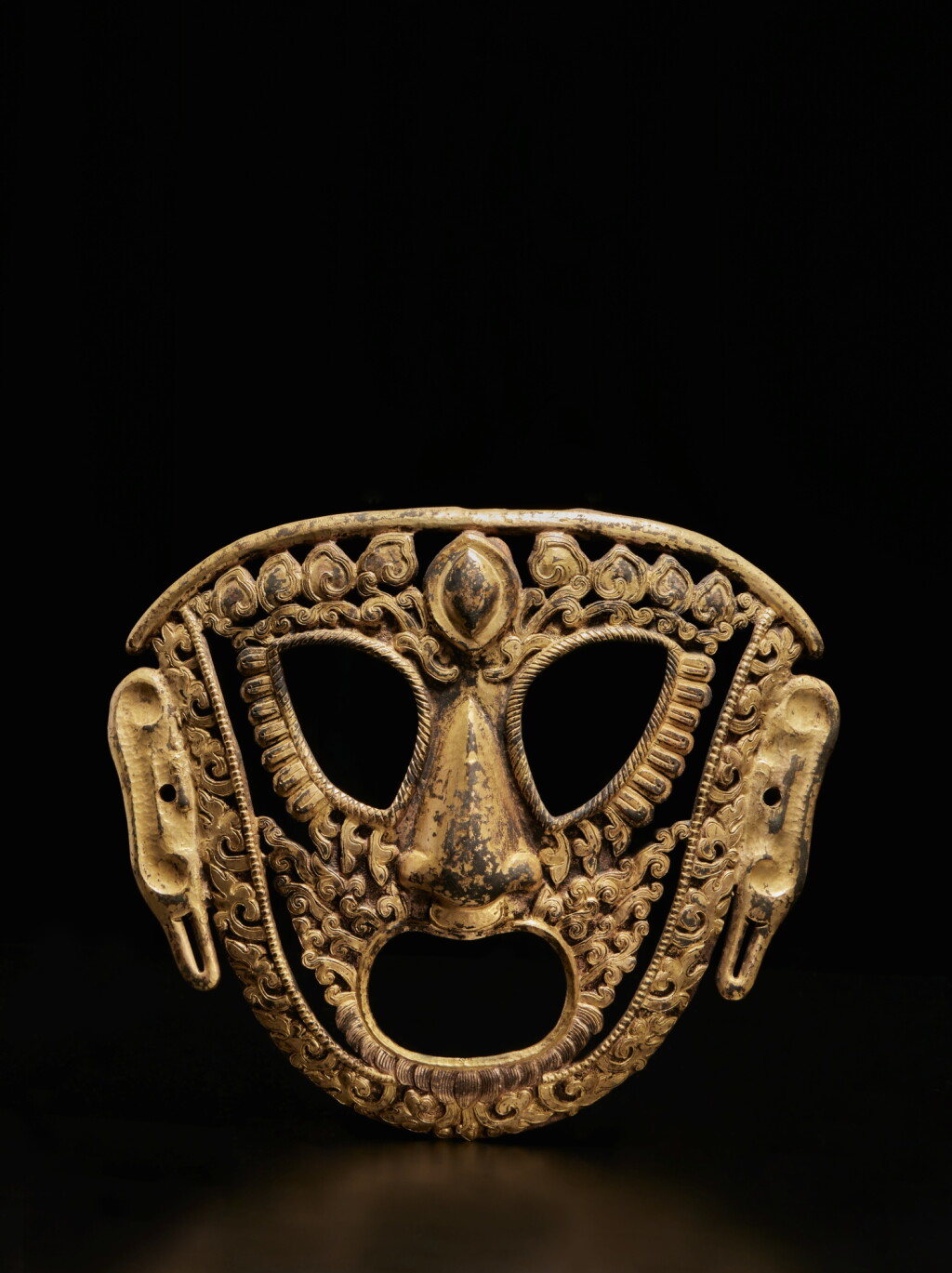 View full screen - View 1 of Lot 350. A gilt-copper repoussé Kalachakra dance mask, Tibet, circa 18th century.