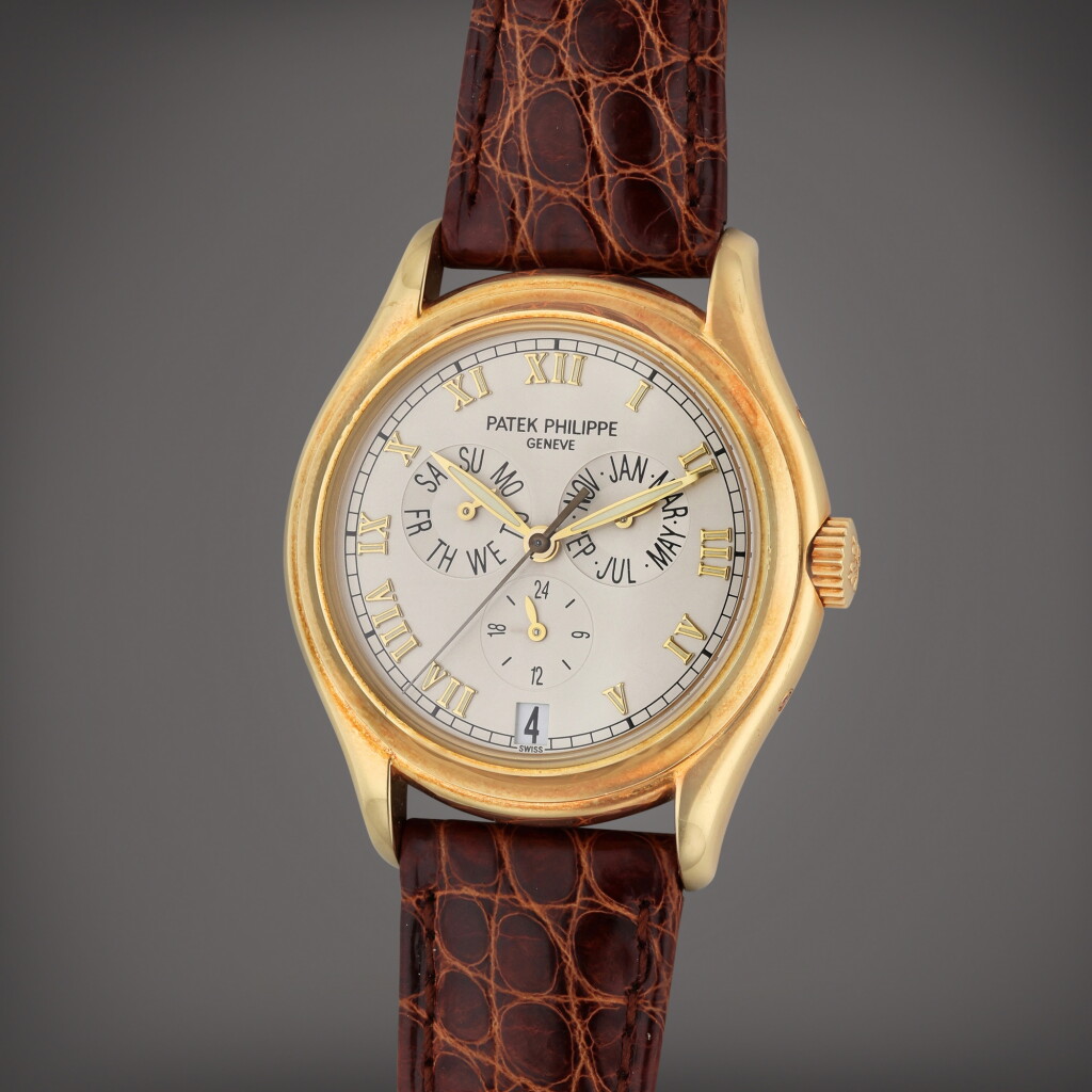 View full screen - View 1 of Lot 25. Reference 5035 | A yellow gold automatic annual calendar wristwatch with 24 hour indication, Made in 1999.