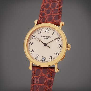 View full screen - View 1 of Lot 135. Reference 5053J-001 | A yellow gold automatic wristwatch with date, Circa 2001.