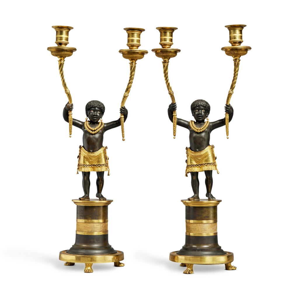 View full screen - View 1 of Lot 1032. A Pair of Directoire Gilt and Patinated Bronze Two-Light Figural Candelabra, Circa 1800.