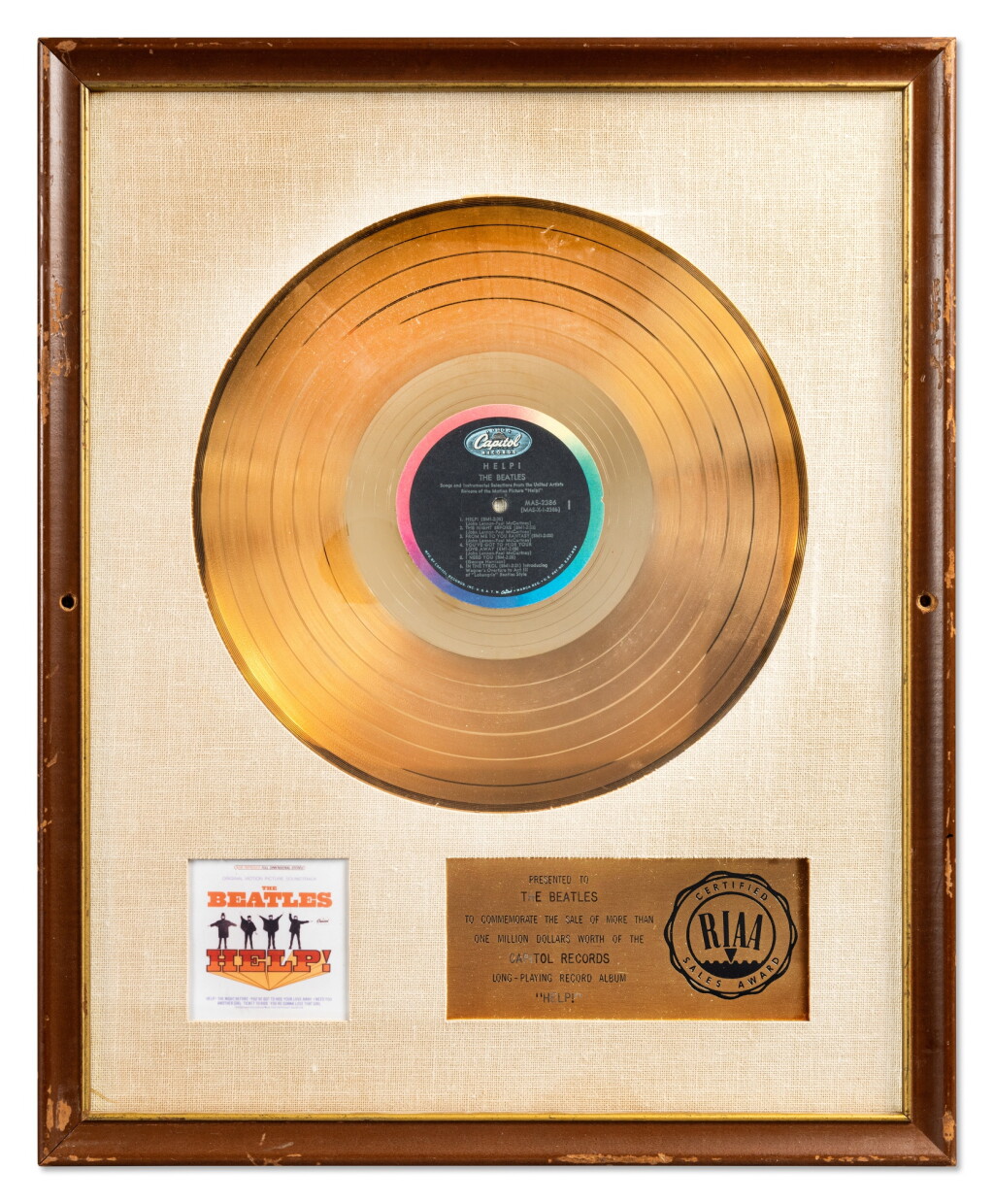 View full screen - View 1 of Lot 18. The Beatles | Gold record presented for "Help!".
