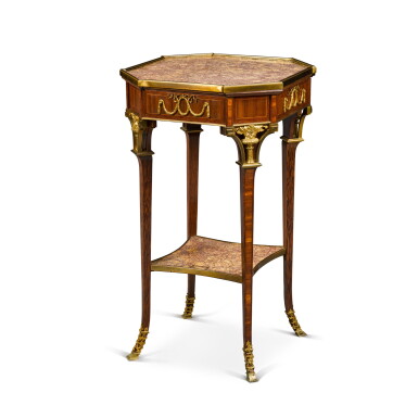 View full screen - View 1 of Lot 91. A Continental gilt-bronze mounted palmwood and bois satiné occasional table, in the neoclassical manner.
