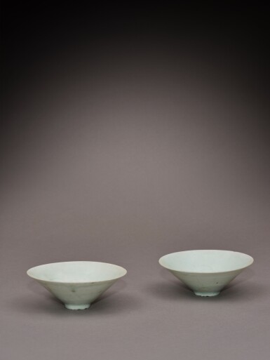 View full screen - View 1 of Lot 79. A pair of carved Qingbai-glazed conical bowls, Song dynasty | 宋 青白釉笠式盌一對.