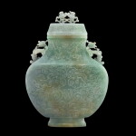A massive jadeite archaistic 'phoenix' vase and cover, Qing dynasty | 清 翠玉鳳紋雙鳳耳帶蓋大扁壺