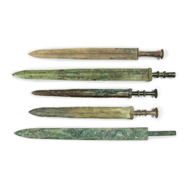 View full screen - View 1 of Lot 1028. A group of five archaic bronze swords, Zhou Dynasty | 周 青銅劍一組五件.