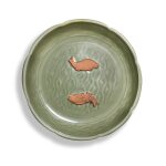 A Longquan celadon-glazed 'fish' washer, Yuan dynasty | 元 龍泉青釉貼雙魚盤