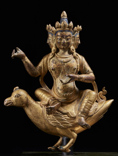View full screen - View 1 of Lot 360. A gilt-copper alloy figure of Brahma seated on a goose, Tibet, 17th / 18th century.