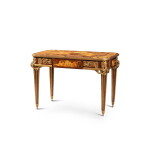 A gilt-bronze mounted amaranth and fruitwood veneered “Muses” desk, second half of the 19th century |Table des muses en placage d'amarante et bois fruitiers, monture de bronze doré, d’après Riesener, deuxième moitié du XIXe siècle