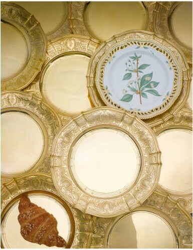 View full screen - View 1 of Lot 82. A SET OF SIXTEEN AMERICAN SILVER-GILT PLACE PLATES, TIFFANY & CO., NEW YORK, CIRCA 1910.