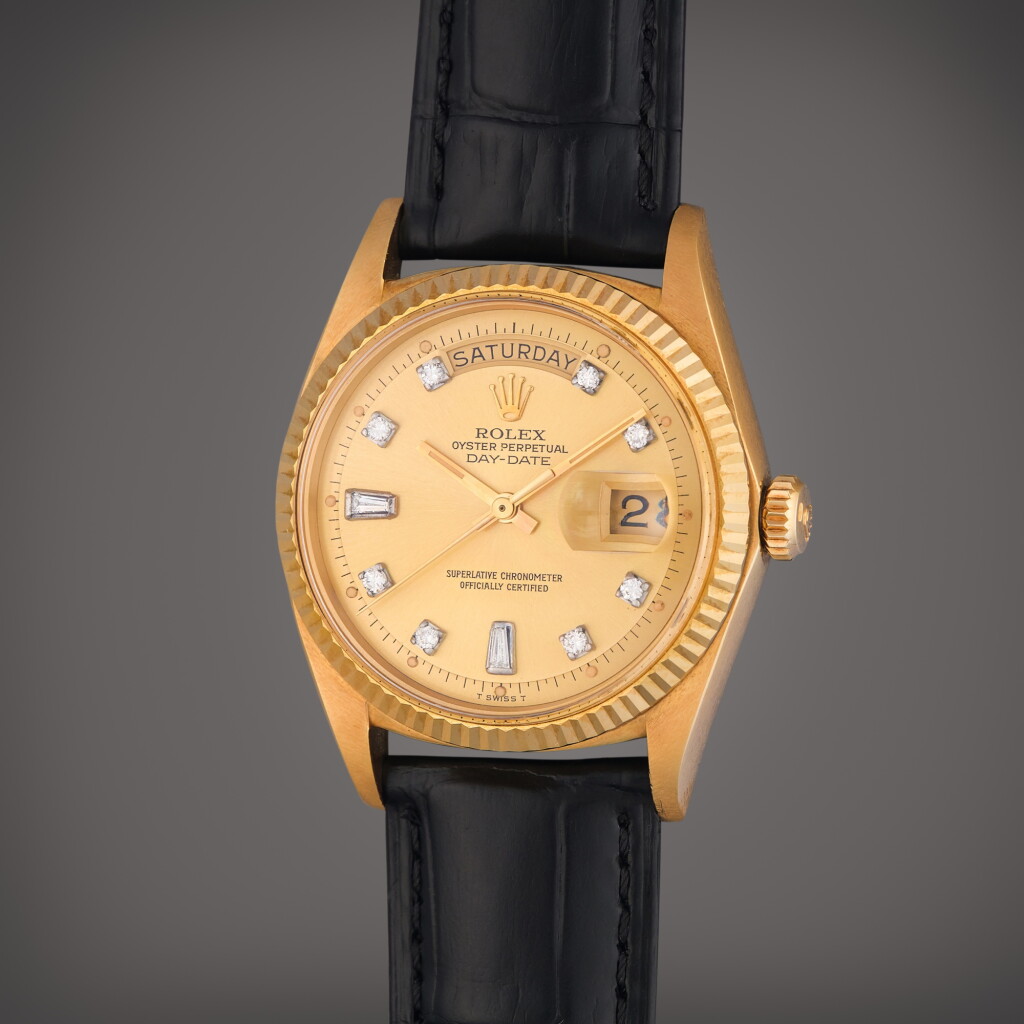 View full screen - View 1 of Lot 323. Reference 1803 Day-Date | A yellow gold and diamond-set automatic wristwatch with day and date, Circa 1971.