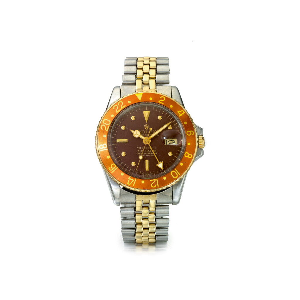 View full screen - View 1 of Lot 876. ROLEX | REF 1675 GMT-MASTER 'TIFFANY & CO. ROOT BEER', RETAILED BY TIFFANY & CO.: A STAINLESS STEEL AND YELLOW GOLD AUTOMATIC DUAL TIME WRISTWATCH WITH DATE AND BRACELET, CIRCA 1972 | 勞力士 | 零售商為蒂芙尼:1675型號「GMT-MASTER 'TIFFANY & CO. ROOT BEER'」精鋼及黃金自動上鏈兩地時間鍊帶腕錶備日期顯示,年份約1972.
