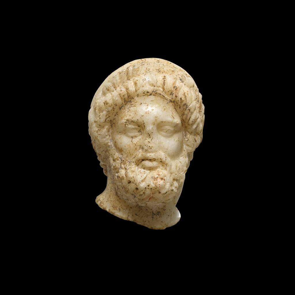 View full screen - View 1 of Lot 33. A MARBLE HEAD OF A MAN OR GOD, 1ST CENTURY B.C/1ST CENTURY A.D..
