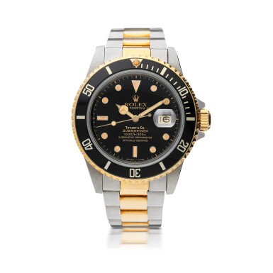 View full screen - View 1 of Lot 43. ROLEX | REFERENCE 16803 SUBMARINER RETAILED BY TIFFANY & CO.: A STAINLESS STEEL AND YELLOW GOLD AUTOMATIC CENTER SECONDS WRISTWATCH WITH DATE AND BRACELET, CIRCA 1986.