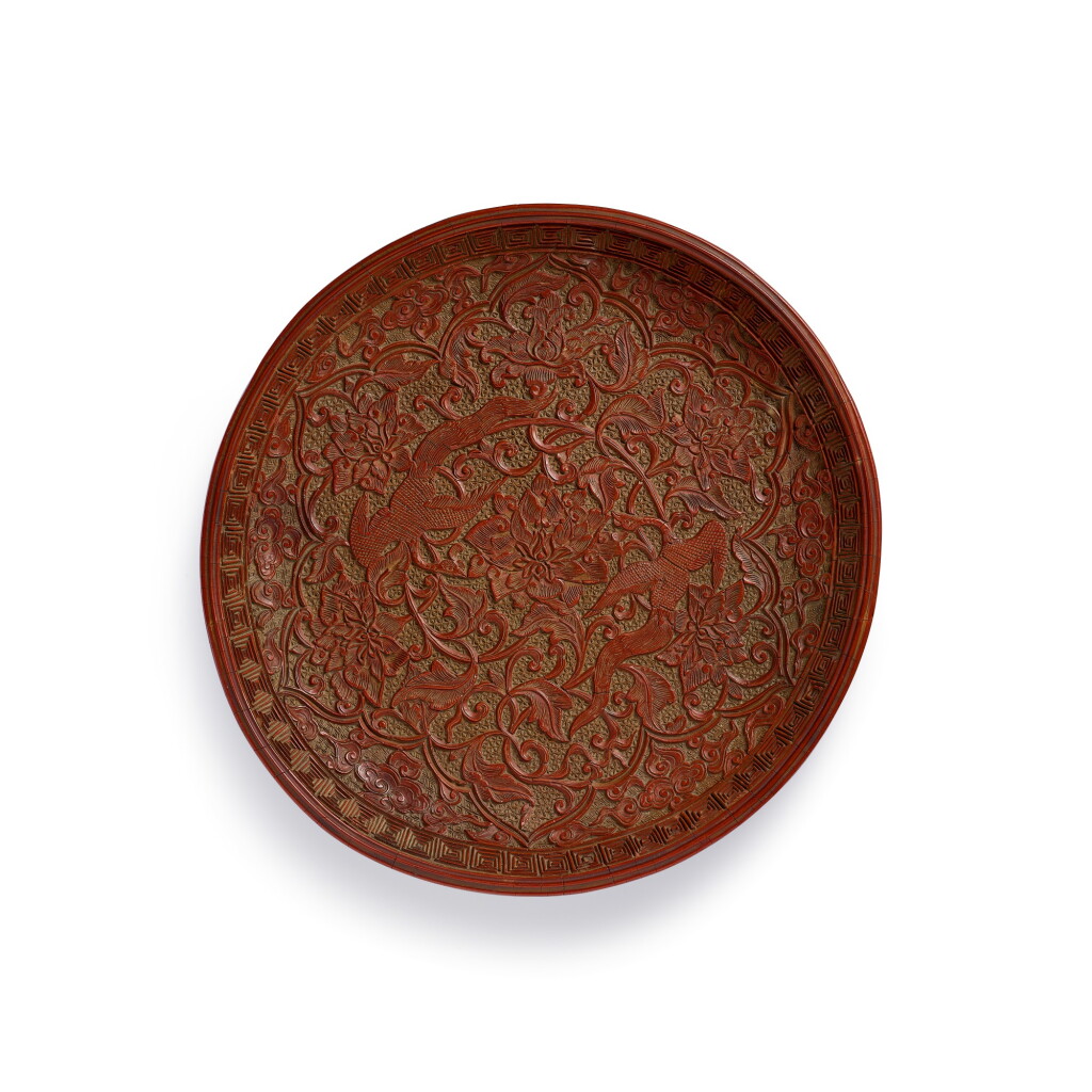 View full screen - View 1 of Lot 38. A rare carved cinnabar lacquer 'phoenix' dish Song dynasty | 宋 剔紅鳳穿牡丹紋盤.