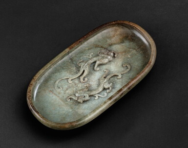 View full screen - View 1 of Lot 165. Rince-pinceaux en jade vert, xi Dynastie Qing | 清 青玉雕雙螭龍洗 | A large green and brown jade brush 'chilong' washer, xi, Qing Dynasty.