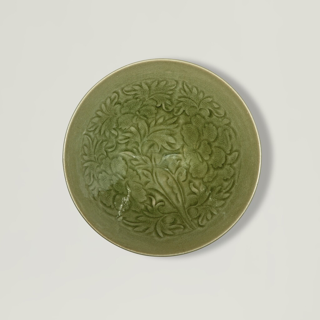 View full screen - View 1 of Lot 132. A carved 'Yaozhou' celadon-glazed 'peony' bowl, Northern Song dynasty .