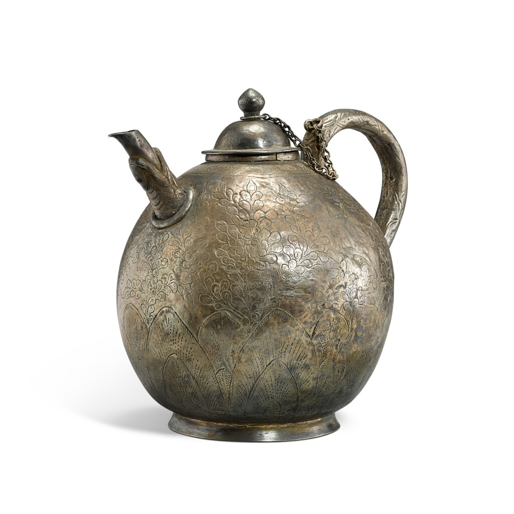 View full screen - View 1 of Lot 555. A silver incised 'floral' ewer and cover, Liao - Jin dynasty 遼至金 銀花卉紋龍首把壺.