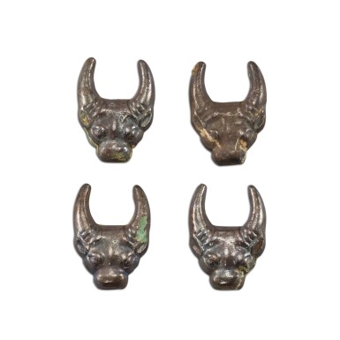 View full screen - View 1 of Lot 3046. A group of four silvered bronze 'buffalo' fittings, Eastern Zhou dynasty 東周 銅鎏銀牛首形飾一組四件.