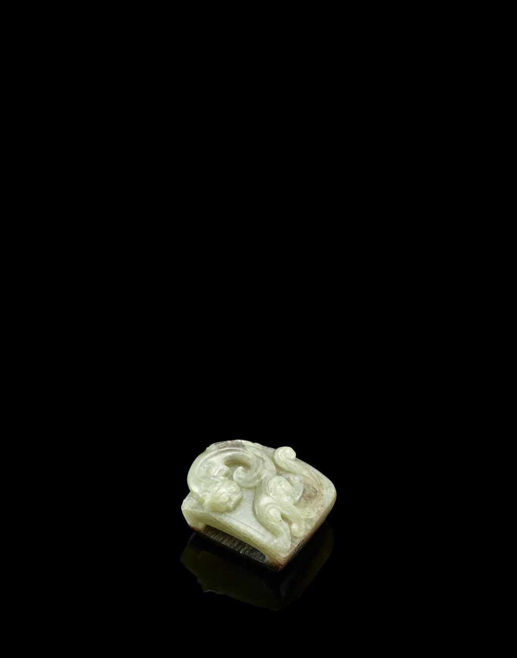 View full screen - View 1 of Lot 3807. A pale celadon and brown jade 'dragon' scabbard slide, Han dynasty | 漢 玉螭龍紋劍璏.