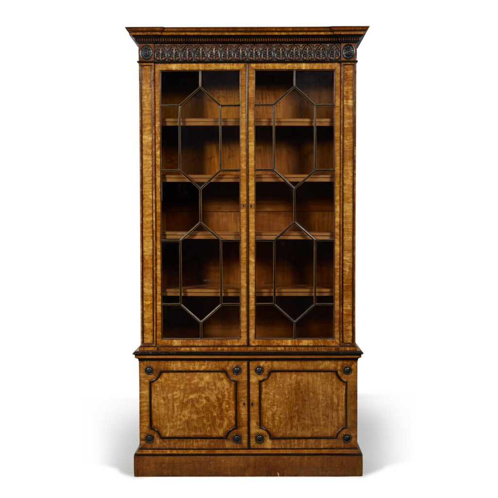 View full screen - View 1 of Lot 65. A George III Ebonized and Satinwood Bookcase, Circa 1780.