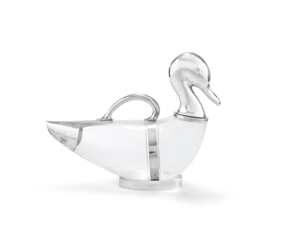 View full screen - View 1 of Lot 45. A duck-shaped glass and silver-plated ewer, unmarked, 20th century | Aiguière en forme de canard en verre et métal argenté, non poinçonnée, XXe siècle.
