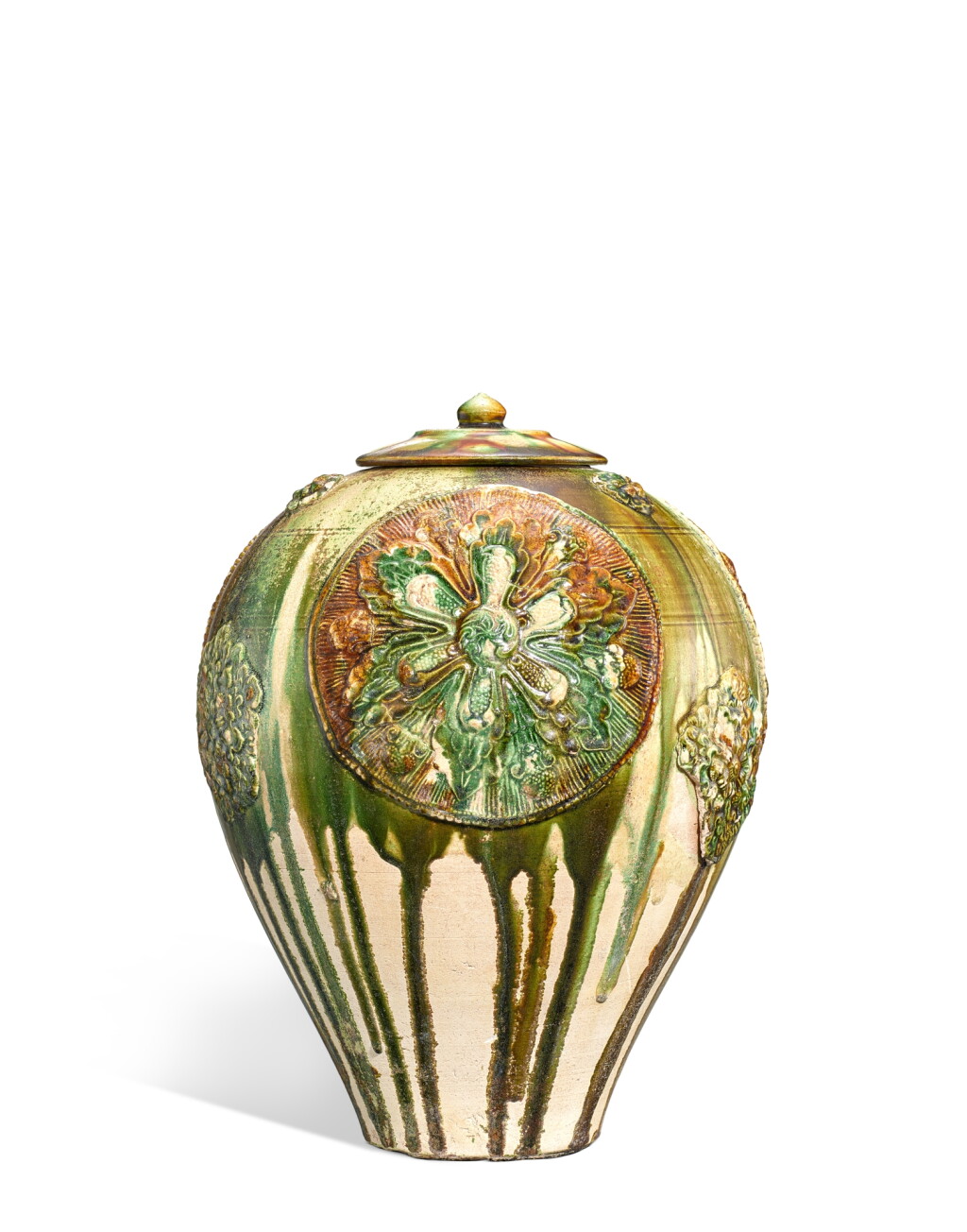 View full screen - View 1 of Lot 610. A very rare appliqué-decorated sancai-glazed 'medallion' jar and cover, Tang dynasty|唐 三彩貼寶相花蓋罐.