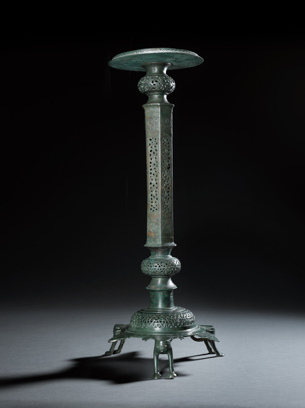 View full screen - View 1 of Lot 12. A large Khurasan bronze lampstand, Eastern Persia, 12th century.