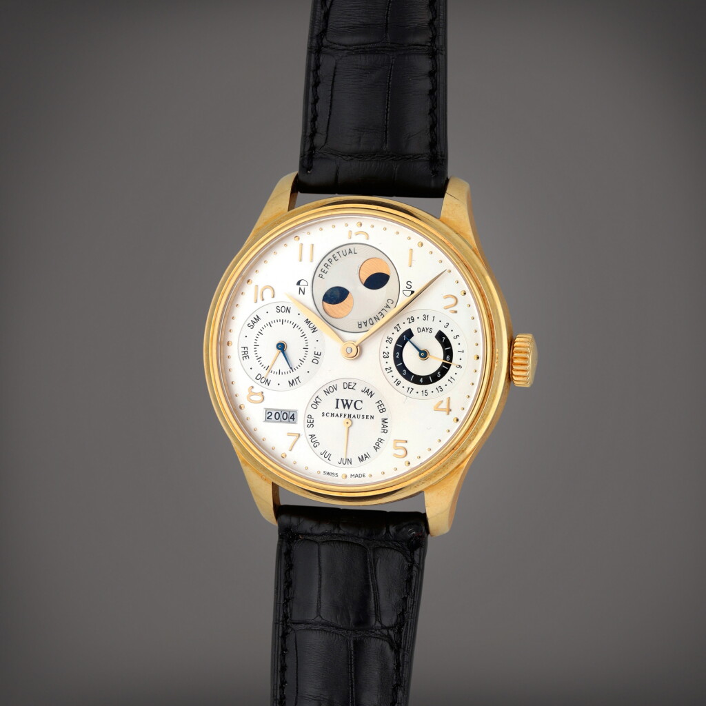 View full screen - View 1 of Lot 415. Portuguese, Reference 502107 | A yellow gold perpetual calendar wristwatch with Northern and Southern hemisphere moon phases, power reserve and year indication | Circa 2003.