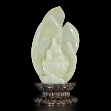 View full screen - View 1 of Lot 182. An inscribed white jade 'Guanyin' boulder, Qing dynasty, 18th / 19th century | 清十八 / 十九世紀 白玉雕蓮花觀音坐像.