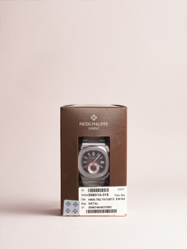View full screen - View 1 of Lot 2593. Nautilus “Red Eight”, Reference 5980 | A possibly unique stainless steel flyback chronograph bracelet watch with date and red dial accents, In double factory seal, Circa 2009.