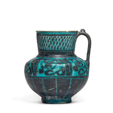 View full screen - View 1 of Lot 64. A Kashan turquoise-glazed silhouette-ware jug, Persia, 12th/13th century.