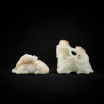 Two pale celadon and russet jade 'deer and lingzhi' groups, Ming - Qing dynasty, 18th century 明至清十八世紀 青白玉鹿銜靈芝兩件