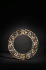 A rare and important gold and silver-inlaid bronze disc, Late Warring States period / Western Han dynasty