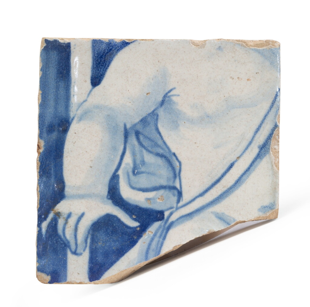 View full screen - View 1 of Lot 330. An earthenware tile fragment, probably Portugal, 17th century.