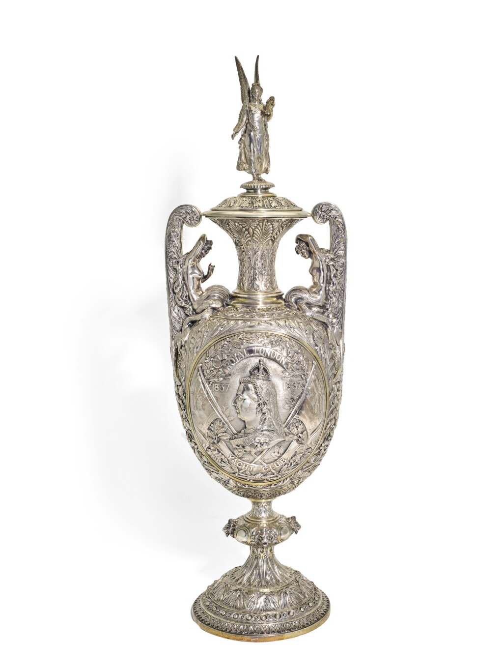 View full screen - View 1 of Lot 139. THE ROYAL LONDON YACHT CLUB JUBILEE CUP. A VICTORIAN SILVER TROPHY VASE AND COVER AFTER DESIGNS AND MODELS BY RAFFAEL MONTI AND OWEN JONES, HANCOCKS & CO., LONDON, 1882/1887.