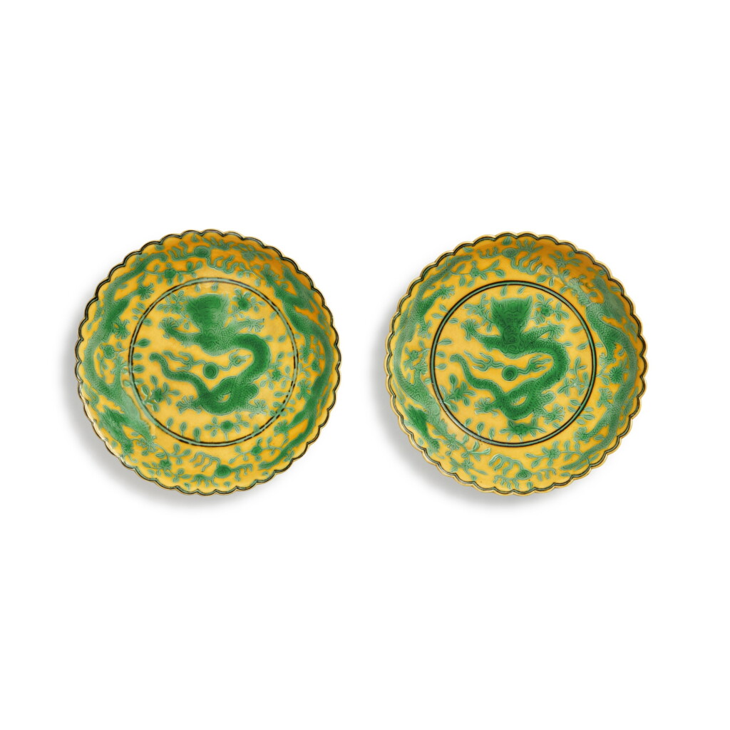 View full screen - View 1 of Lot 523. A pair of yellow-ground green-enameled 'dragon' foliate-rim dishes, Seal marks and period of Qianlong | 清乾隆 黃地綠彩趕珠龍紋花口小盤一對 《大清乾隆年製》款.