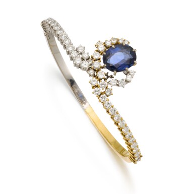 View full screen - View 1 of Lot 52. Sapphire and diamond bangle.