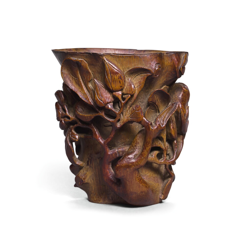 View full screen - View 1 of Lot 64. A BAMBOO LIBATION CUP, QING DYNASTY, 18TH CENTURY | 清十八世紀 竹雕花卉紋椿式杯.