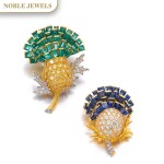 VERDURA | PAIR OF SAPPHIRE, EMERALD AND DIAMOND BROOCHES, 'THISTLE', 1960