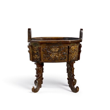 View full screen - View 1 of Lot 3676. A parcel-gilt bronze 'bajixiang' incense burner, ding Ming dynasty, Xuande mark | 明 局部鎏金銅八吉祥衝天耳鼎式爐 《大明宣德年製》仿款.