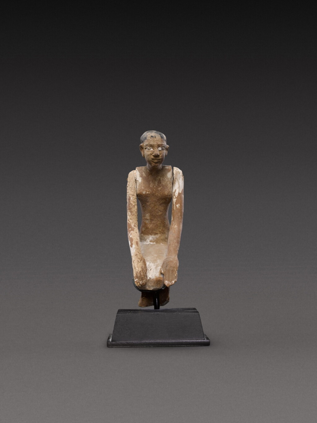 View full screen - View 1 of Lot 134. An Egyptian Polychrome Wood Figure of a Boatman, 11th/early 12th dynasty, circa 2081-1850 B.C..