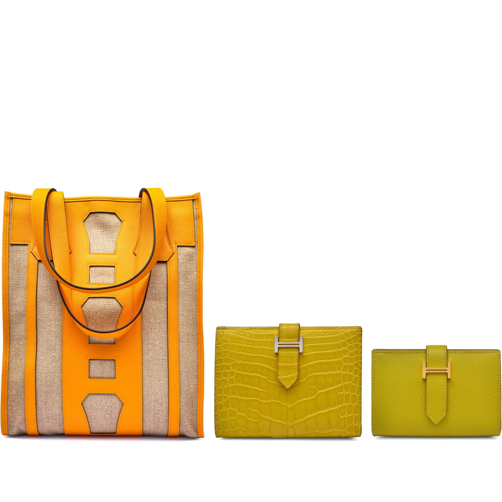 View full screen - View 1 of Lot 119. Set Of Three, One Petit H Jaune D'Or Calfskin and Canvas Bell Tote Bag, One Mimosa Mississippiensis Alligator Bearn Wallet Palladium Hardware, 2019 and One Lime Epsom Compact Bearn Wallet Gold Hardware.
