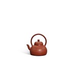 A Yixing handled teapot, Qing dynasty, Qianlong period | 清乾隆 宜興紫砂菊瓣紋提樑壺