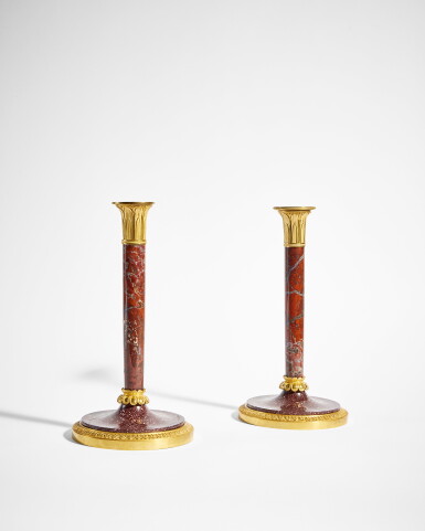 View full screen - View 1 of Lot 724. A Pair of Empire Gilt-Bronze Mounted Jasper and Porphyry Candlesticks, Attributed to Lucien-François Feuchère, Circa 1805.