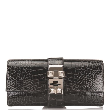 View full screen - View 1 of Lot 19. Hermès Medor 23cm of Graphite Shiny Mississippiensis Alligator with Palladium Hardware.