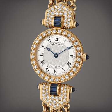 View full screen - View 1 of Lot 321. A yellow gold and diamond and sapphire-set wristwatch with bracelet, Circa 1990.